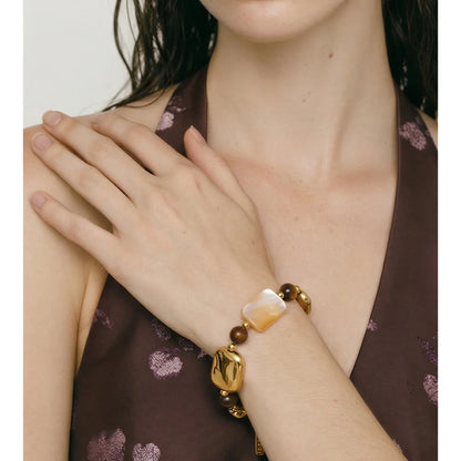 Pulseira Artesanal de Aço Inoxidável Yhpup com Concha Natural e Pedra Olho de Tigre – Joia Exquisita e Charmosa Feita à Mão